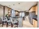 Spacious kitchen with a granite island and modern bar seating at 10774 Chadsworth Ln, Highlands Ranch, CO 80126