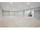 Expansive finished basement with neutral carpeting and recessed lighting, plus stairway access at 13275 E Caley Pl, Centennial, CO 80111