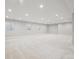 Spacious basement with neutral carpet, recessed lighting, and ample natural light from multiple windows at 13275 E Caley Pl, Centennial, CO 80111