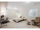 Carpeted bedroom with natural light, desk, and chair at 13275 E Caley Pl, Centennial, CO 80111