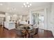 Open dining area with modern table, chairs, and sliding glass door to the deck at 13275 E Caley Pl, Centennial, CO 80111