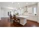 Modern kitchen with white cabinetry, stainless steel appliances, and a large center island at 13275 E Caley Pl, Centennial, CO 80111