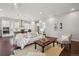 Spacious living room showcases an open layout, hardwood floors, and views of the kitchen at 13275 E Caley Pl, Centennial, CO 80111