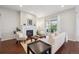Bright living room featuring a fireplace, sliding glass doors, and stylish furnishings at 13275 E Caley Pl, Centennial, CO 80111
