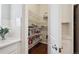 Walk-in pantry provides abundant storage, shelving, and easy access to kitchen essentials at 13275 E Caley Pl, Centennial, CO 80111
