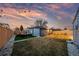 Cozy backyard space with modern turf, fire pit, and comfortable seating, perfect for outdoor relaxation at 4510 W 4Th Ave, Denver, CO 80219