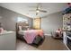 Comfortable bedroom featuring a sliding barn door and ample natural light at 4510 W 4Th Ave, Denver, CO 80219