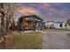 Charming single-Gathering home features a welcoming porch with outdoor seating and well-maintained landscaping at 4510 W 4Th Ave, Denver, CO 80219
