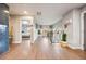 Hallway with hardwood floors and access to bedrooms, creating a seamless flow throughout the home at 4510 W 4Th Ave, Denver, CO 80219