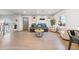 Inviting living room with hardwood floors, a comfortable leather sofa, and abundant natural light at 4510 W 4Th Ave, Denver, CO 80219