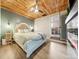 Luxurious main bedroom featuring a wood ceiling and access to the main bathroom at 4510 W 4Th Ave, Denver, CO 80219