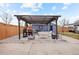 Inviting outdoor patio area with pergola, barbecue, and seating, perfect for entertaining guests at 4510 W 4Th Ave, Denver, CO 80219