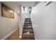 Carpeted staircase leading upwards, with subtle lighting and neutral-toned walls at 4510 W 4Th Ave, Denver, CO 80219
