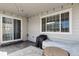 Covered back patio with overhead string lights, offering a cozy space for outdoor relaxation and entertaining at 4830 S Versailles St, Aurora, CO 80015