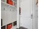 Functional mudroom with built-in storage, hooks, and bench for easy organization near the front door at 4830 S Versailles St, Aurora, CO 80015