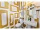 Modern powder room with patterned wallpaper, a round mirror, and a pedestal sink at 2087 Generations Aly, Brighton, CO 80601
