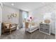 A sweet Bedroom features a crib, rocking chair, cute decor and a window providing ample light at 2087 Generations Aly, Brighton, CO 80601