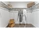 A well organized walk-in closet featuring shelving, hanging rods, plush carpet, and stylish robes at 2087 Generations Aly, Brighton, CO 80601