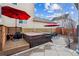 Backyard featuring a hot tub, lounge seating, and patio area, perfect for outdoor relaxation at 3269 Uinta St, Denver, CO 80238