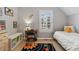 Bright bedroom with a solar system rug, space theme, and natural light at 3269 Uinta St, Denver, CO 80238