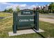 Sign for Denver Parks and Recreation's Central Park with manicured lawn and shade trees at 3269 Uinta St, Denver, CO 80238