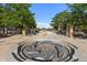 Community water feature with unique circular design and trees, creating a relaxing atmosphere at 3269 Uinta St, Denver, CO 80238