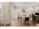 Bright dining area with table, chairs, sliding glass doors and hardwood floors at 3269 Uinta St, Denver, CO 80238