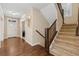 Inviting foyer with hardwood floors, staircase, and natural light from the front door at 3269 Uinta St, Denver, CO 80238