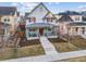 Charming two-story home with a well-manicured front yard and inviting front porch at 3269 Uinta St, Denver, CO 80238