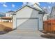 Spacious two-car garage with modern doors and ample parking space, providing convenience and security at 3269 Uinta St, Denver, CO 80238