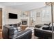 Stylish living room features a fireplace, large windows with shutters and comfortable seating at 3269 Uinta St, Denver, CO 80238