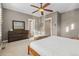 Main bedroom featuring neutral colors, a carved wooden chest, and bright windows at 3269 Uinta St, Denver, CO 80238