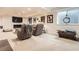 Finished basement area featuring comfortable seating, a fireplace, and a large window at 9724 Crowsley Ct, Parker, CO 80134