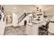 Cozy basement with a stylish bar, granite countertops, seating, and convenient access to the staircase at 9724 Crowsley Ct, Parker, CO 80134