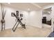 Spacious basement area with neutral carpet, white trim, and a separate door leading to another room at 9724 Crowsley Ct, Parker, CO 80134