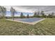 Outdoor basketball court surrounded by trees offers a recreational space for residents and visitors to the community at 9724 Crowsley Ct, Parker, CO 80134