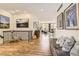 Welcoming foyer with wood floors, a decorative bench and stairway to living area, full of natural light at 9724 Crowsley Ct, Parker, CO 80134
