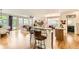 Open living room with hardwood floors, granite kitchen island, and a fireplace at 9724 Crowsley Ct, Parker, CO 80134