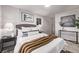 Cozy bedroom with plush bedding and modern decor at 5550 E Thrill Pl, Denver, CO 80207