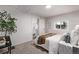 Bright bedroom with a view into the kitchen at 5550 E Thrill Pl, Denver, CO 80207