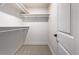 Bright walk-in closet with double hanging rods and shelving at 5550 E Thrill Pl, Denver, CO 80207