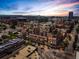 Stunning aerial view of the urban neighborhood, displaying the unique architecture and vibrant city skyline at sunset at 1499 Blake St # 3U, Denver, CO 80202