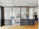 Bedroom with sliding glass doors, stylish decor, and ample natural light at 1499 Blake St # 3U, Denver, CO 80202