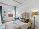 Bright bedroom featuring stylish décor, a comfortable bed, and ample natural light at 1499 Blake St # 3U, Denver, CO 80202