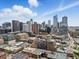 Breathtaking aerial view of the city skyline, highlighting the building's location and surrounding urban environment at 1499 Blake St # 3U, Denver, CO 80202