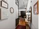 Hallway showcasing stylish decor and art, with a partial view into the living room and its modern design at 1499 Blake St # 3U, Denver, CO 80202
