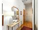 Inviting hallway with hardwood floors, stylish decor, and ample natural light at 1499 Blake St # 3U, Denver, CO 80202