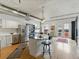 Bright kitchen with stainless steel appliances, center island with breakfast bar, hardwood floors, and access to an outdoor balcony at 1499 Blake St # 3U, Denver, CO 80202