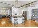 Stylish kitchen with modern cabinetry, stainless steel appliances, and a center island with seating, complemented by hardwood flooring at 1499 Blake St # 3U, Denver, CO 80202