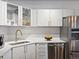 Bright kitchen with marble countertops, stainless steel appliances, and modern white cabinetry at 1499 Blake St # 3U, Denver, CO 80202